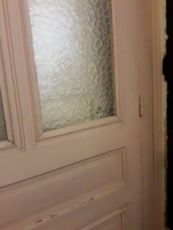 Large glazed door and its old glazed transom.
