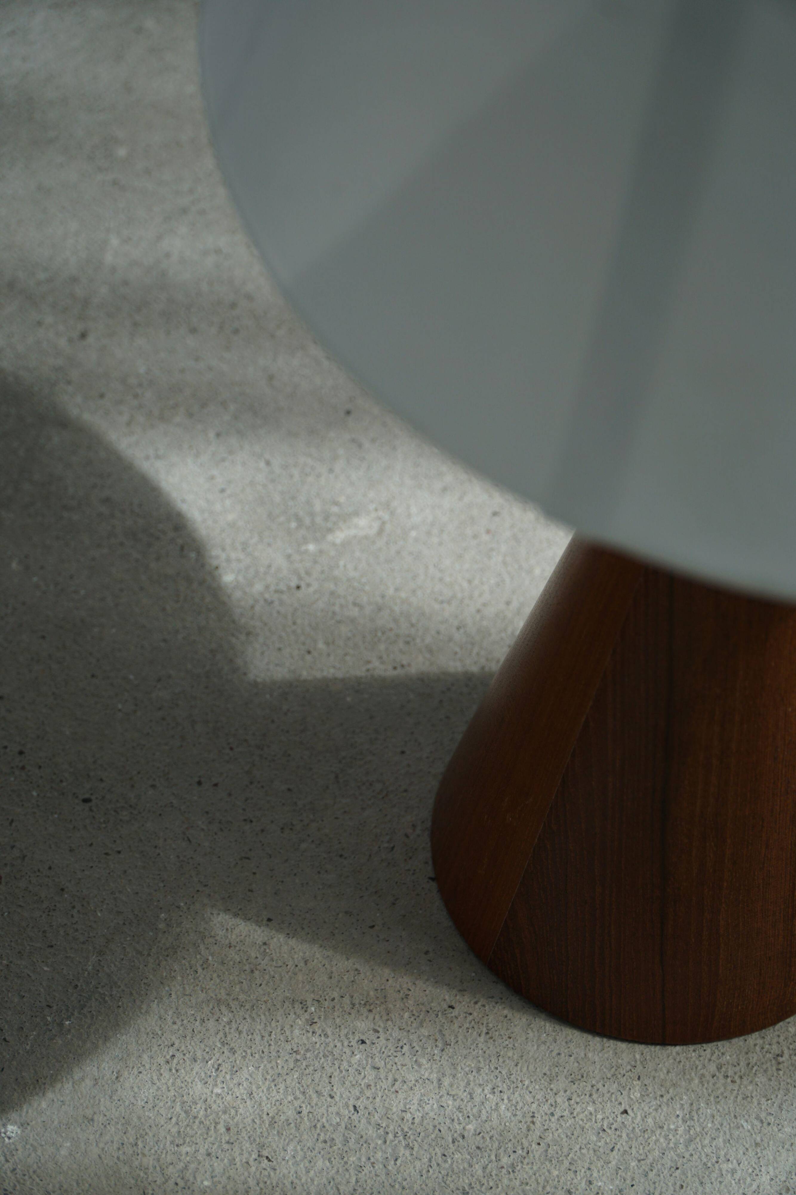 Modern Danish, a conical table lamp in teak, 1980s.