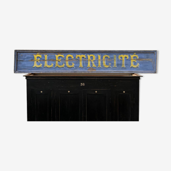 Large store sign painted on wood