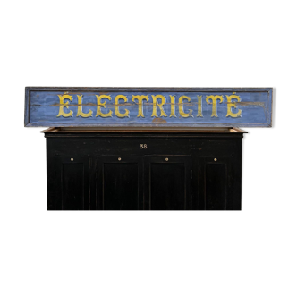 Large store sign painted on wood