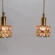 Two pendant lights in gilded brass and crystal, by Palwa, design 1960