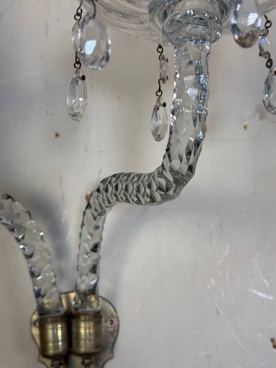 Pair of cut crystal wall sconces in the style of Maydwell and Windle, England, 18th century.