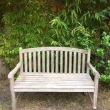 Vintage wooden garden bench with wheels