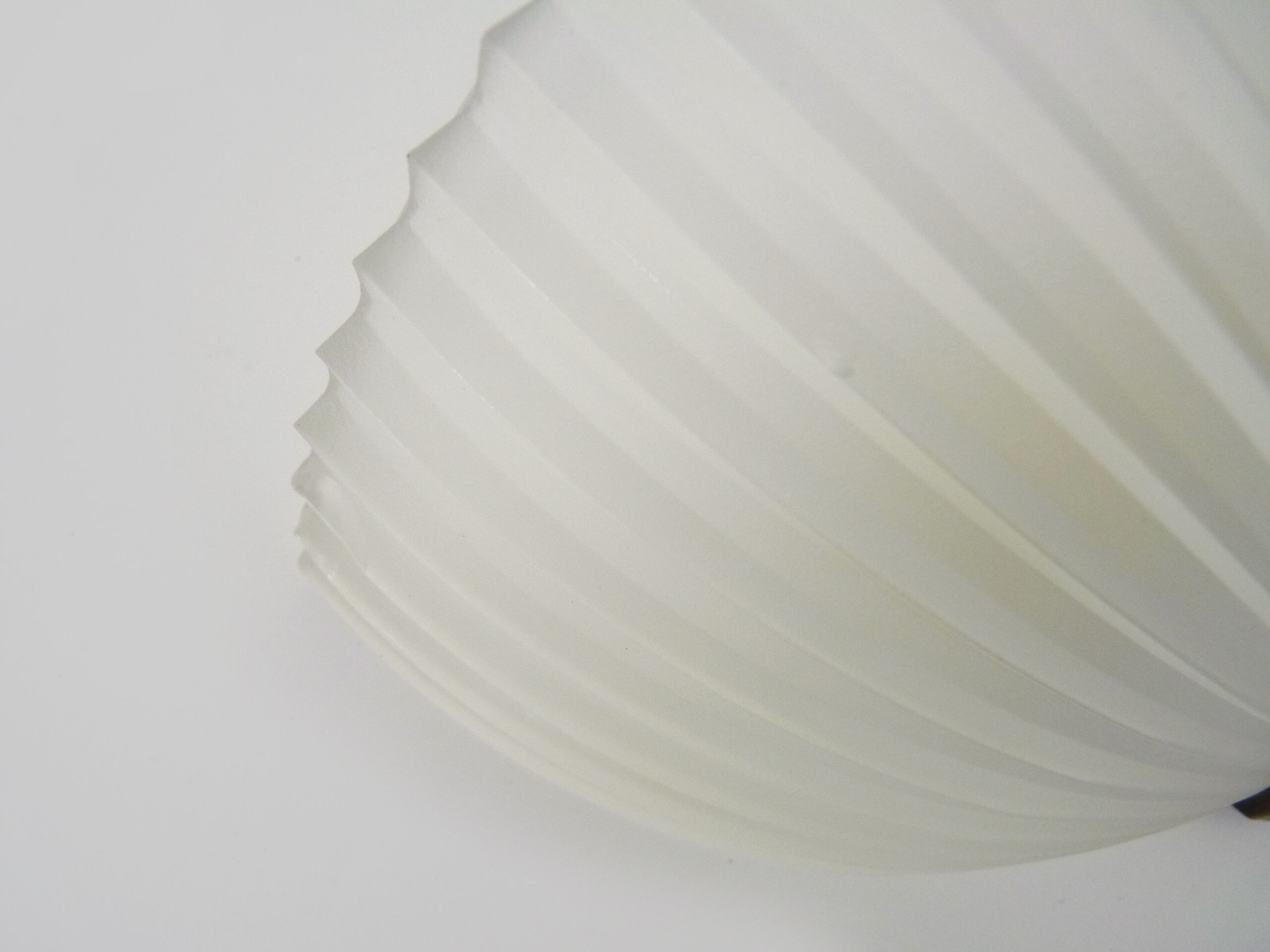 Pair of Mathias wall lamps in gilded metal and white shell-style glass