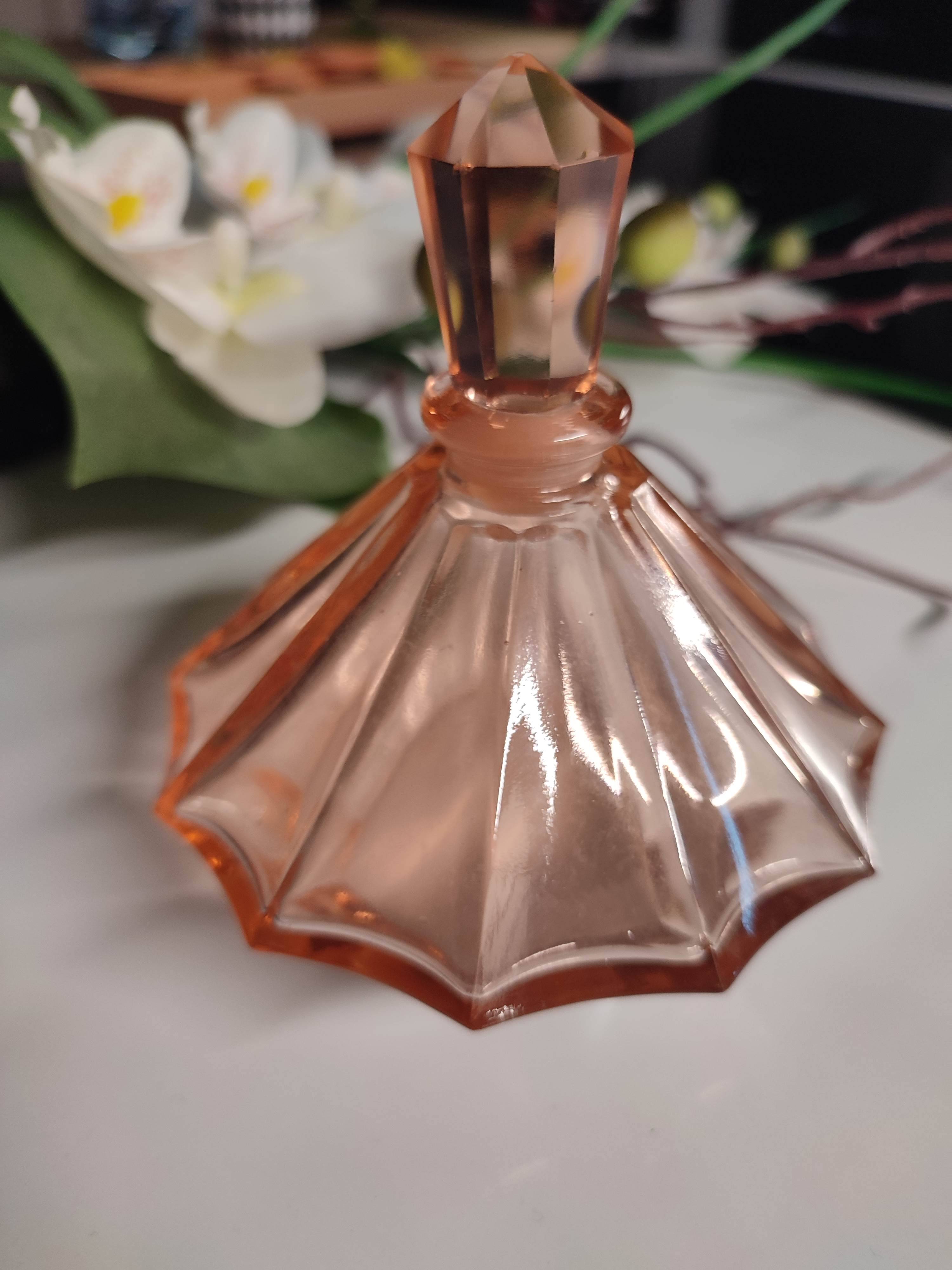 Vintage Art Deco perfume bottle in beautiful pink glass.