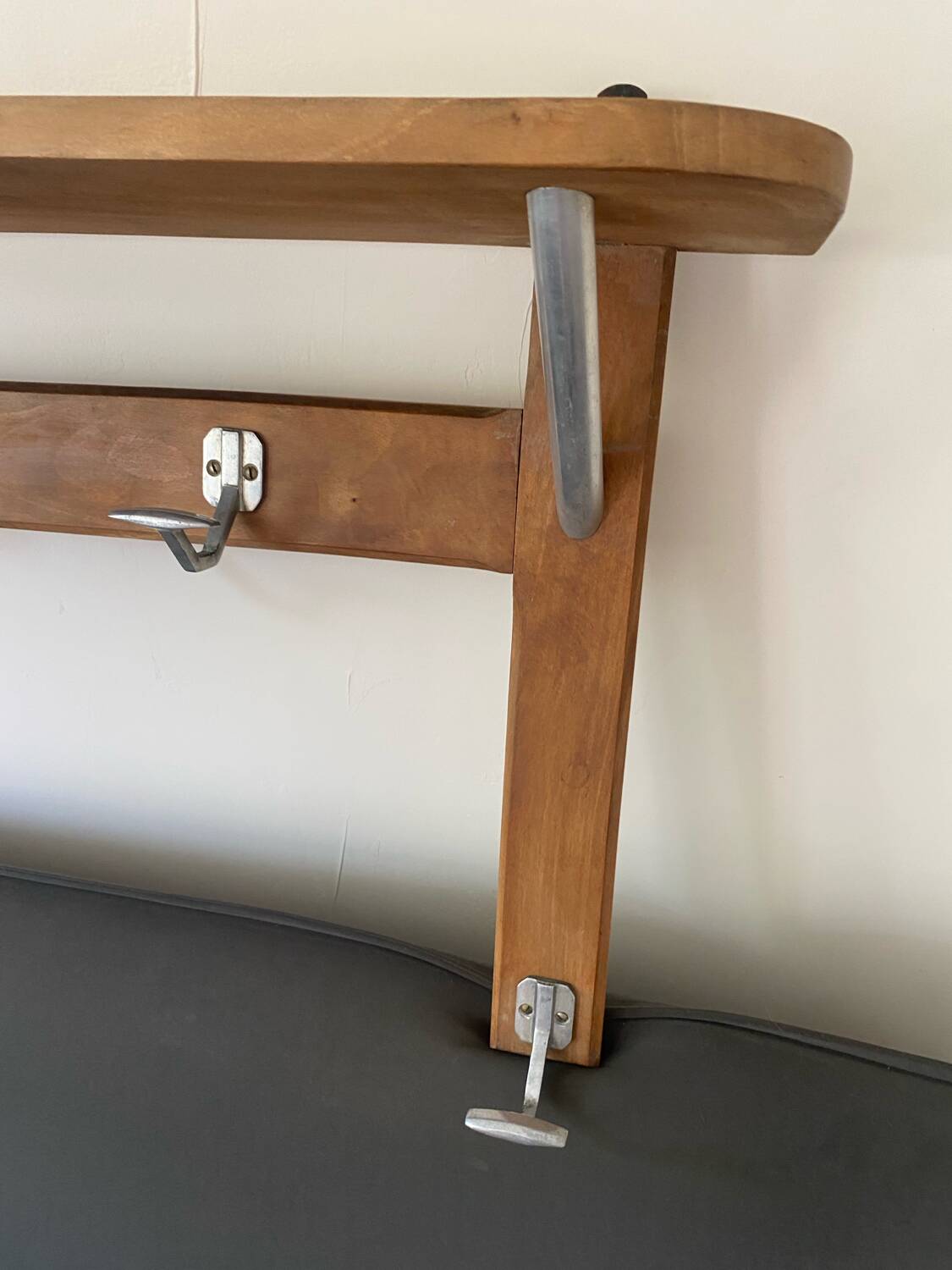 Wall-mounted coat rack with vintage hooks