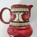 Red water pitcher and assorted plate