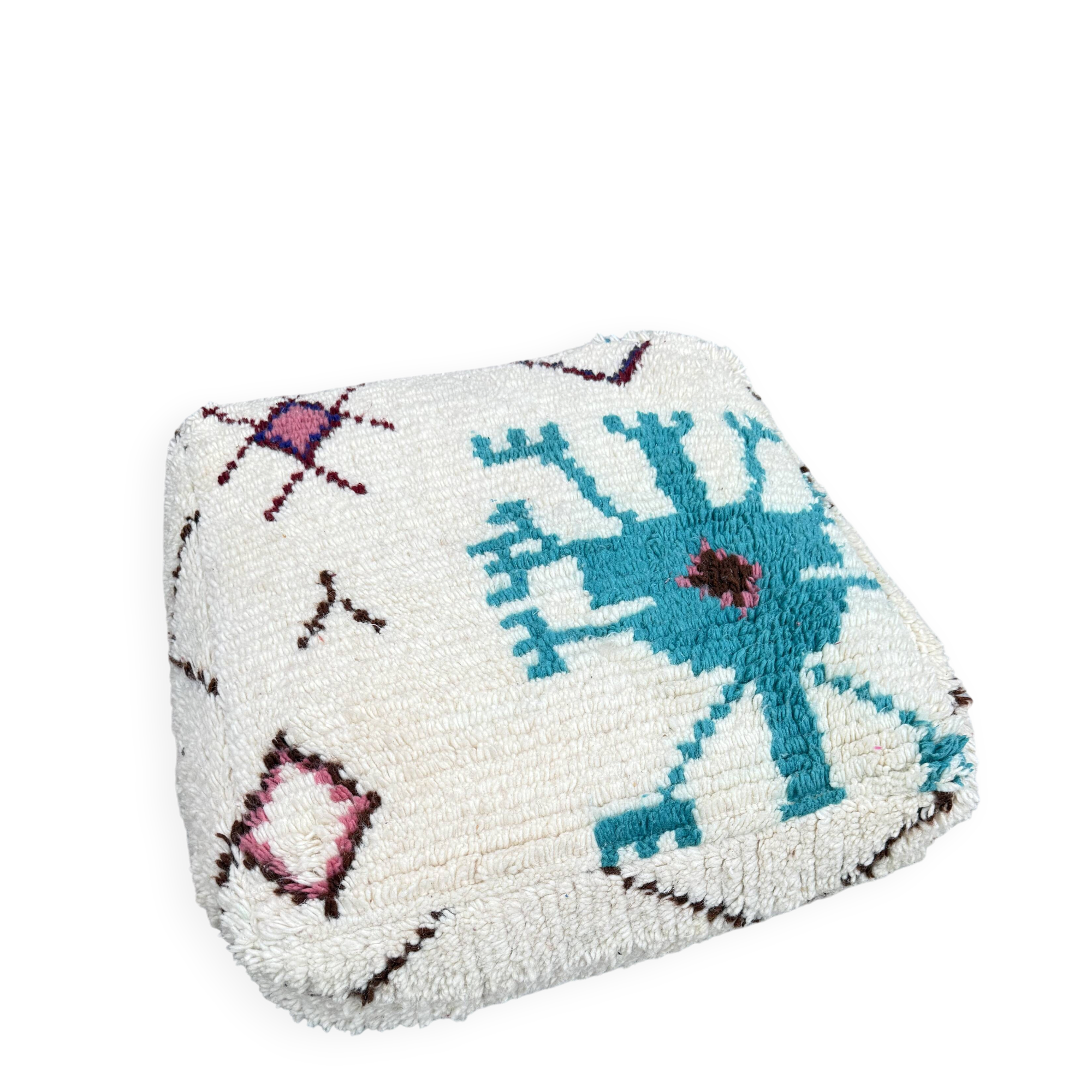 Berber floor pouf: Handwoven Moroccan wool cushion.
