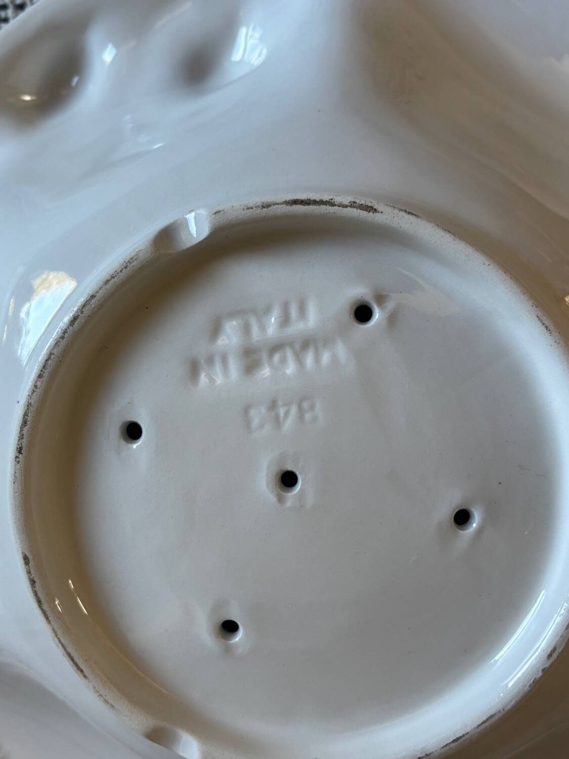 Plate and colander of lemons in slipware