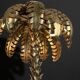 Gold metal palm lamp with glass plate base in 70s style