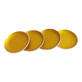 Set of four enameled coasters - ashtrays in original yellow color.