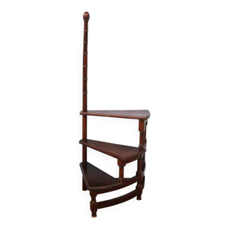 Spiral staircase for library made of mahogany wood