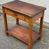 Vintage farmhouse dessert trolley on wheels made of solid wood from the 19th century.