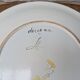 Plate with hand-painted flower bouquet on light blue background 25cm