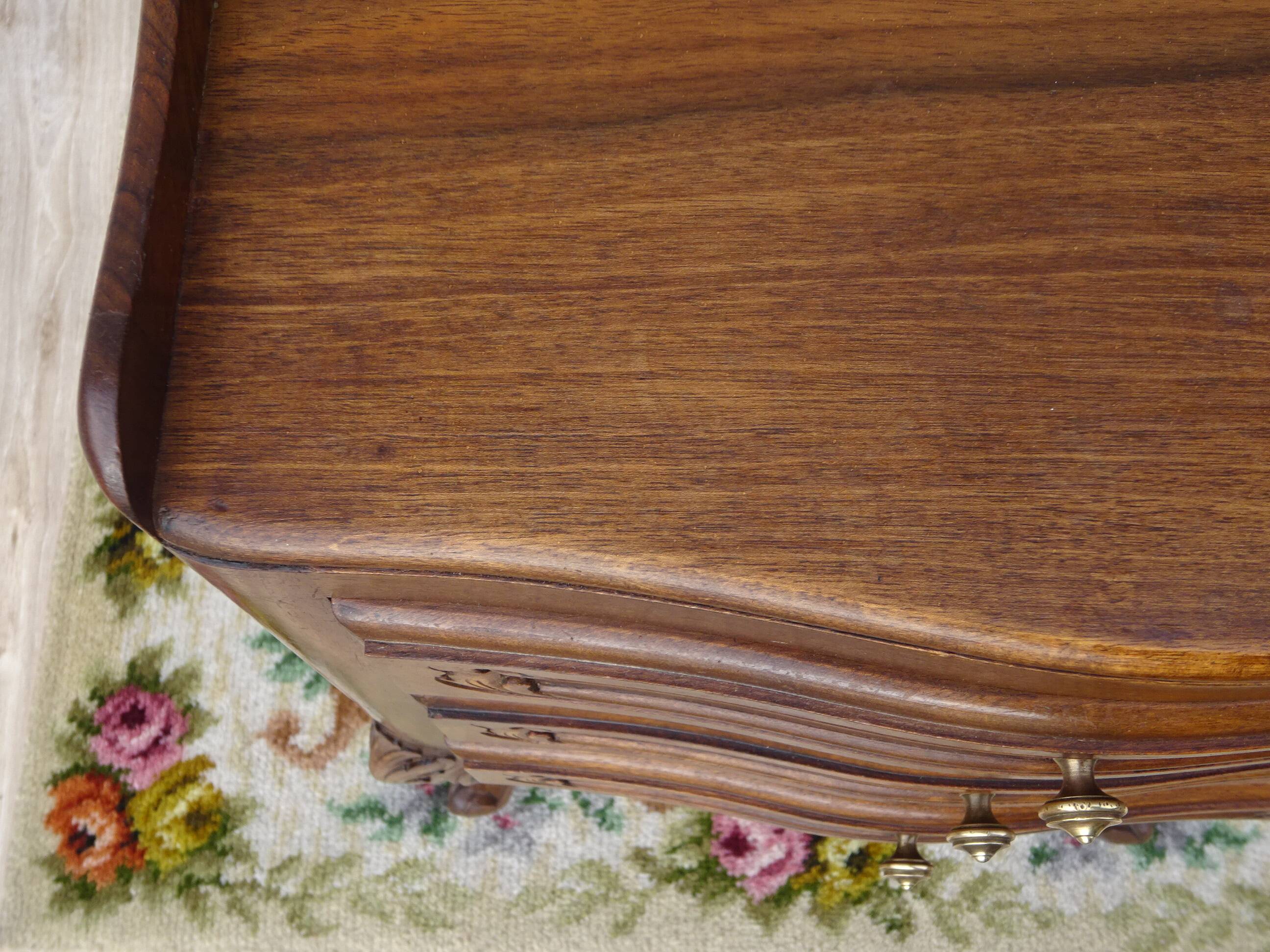 Louis XV bedside table in walnut, 3 drawers, raised edges on the tops.