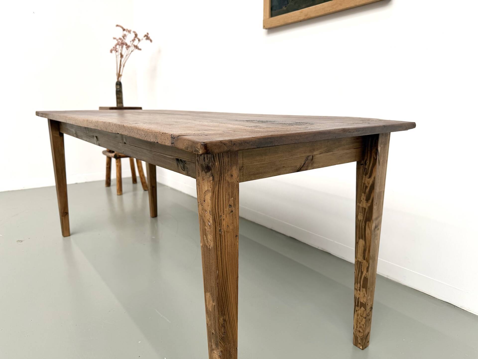 Farm table in walnut with spindle legs.