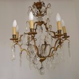 French Louis XV chandelier with 8 lights in gilded bronze, glass and crystal.