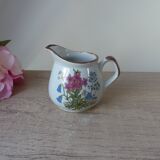 Old small artisanal milk jug in flowered speckled stoneware from the 1980s