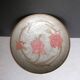 Enamelled brass stand with floral decoration.