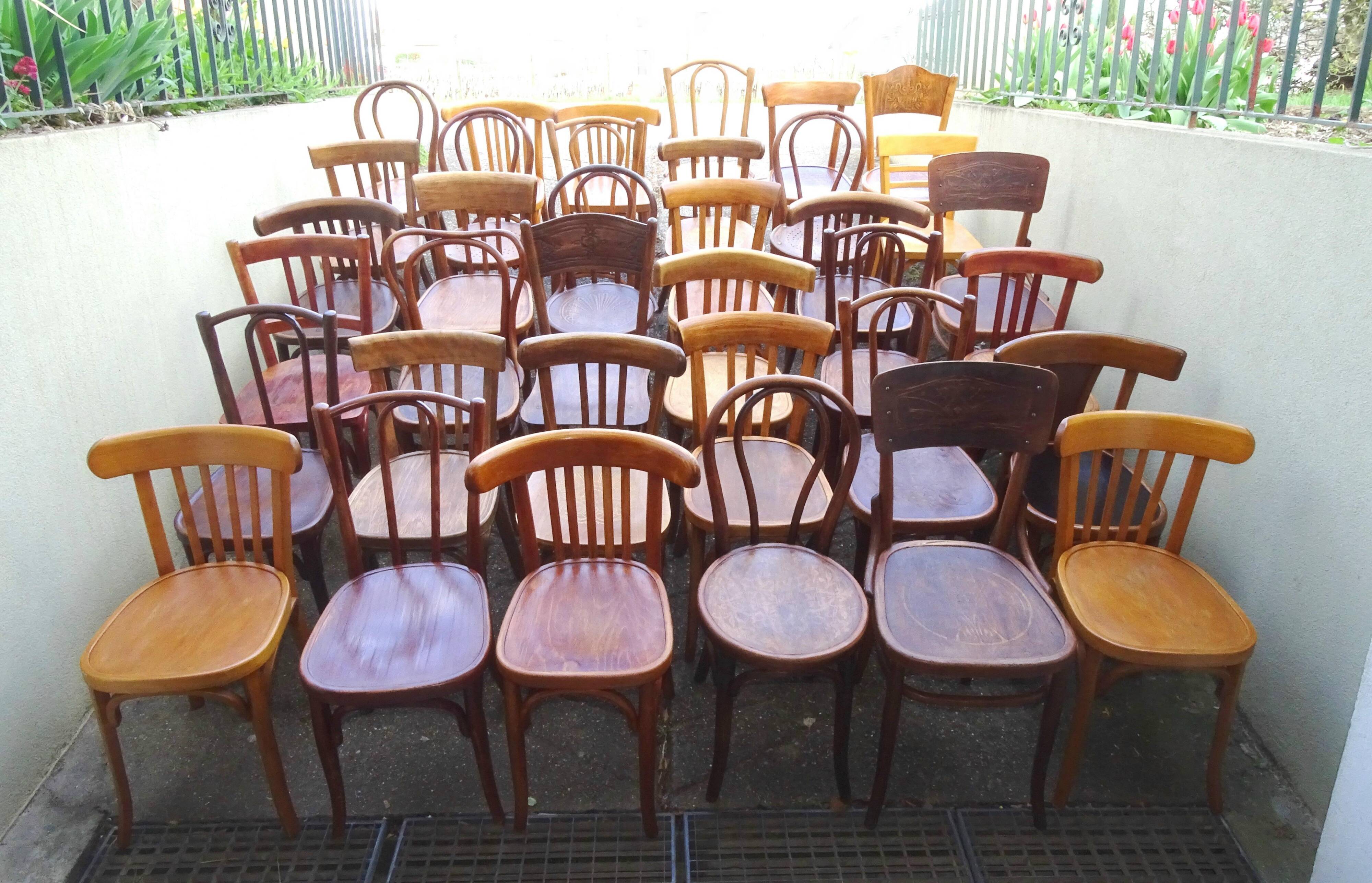 Set of 36 mismatched Bistrot chairs, 1920 to 1950, wooden seats.