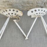 Pair of industrial tripod stools with tractor seat, 50s