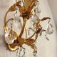 Hand-forged wall lamp gilded with gold leaf and crystals, Italy