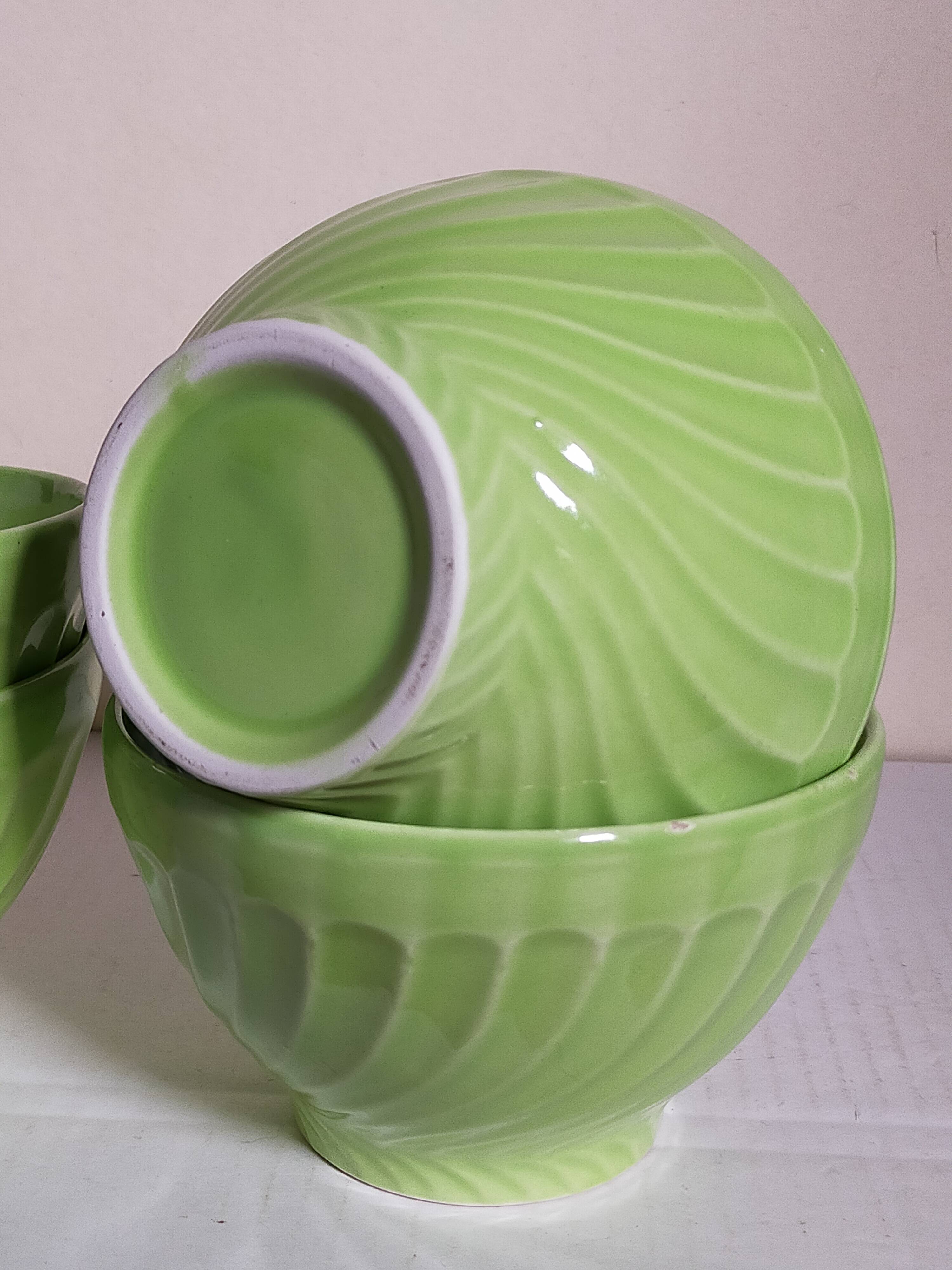 Four vintage spring green earthenware bowls