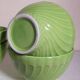 Four vintage spring green earthenware bowls