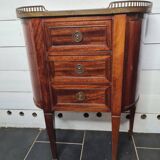 curved mahogany chest of drawers with marble top