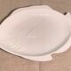 Serving dish in the shape of a white glazed ceramic fish
