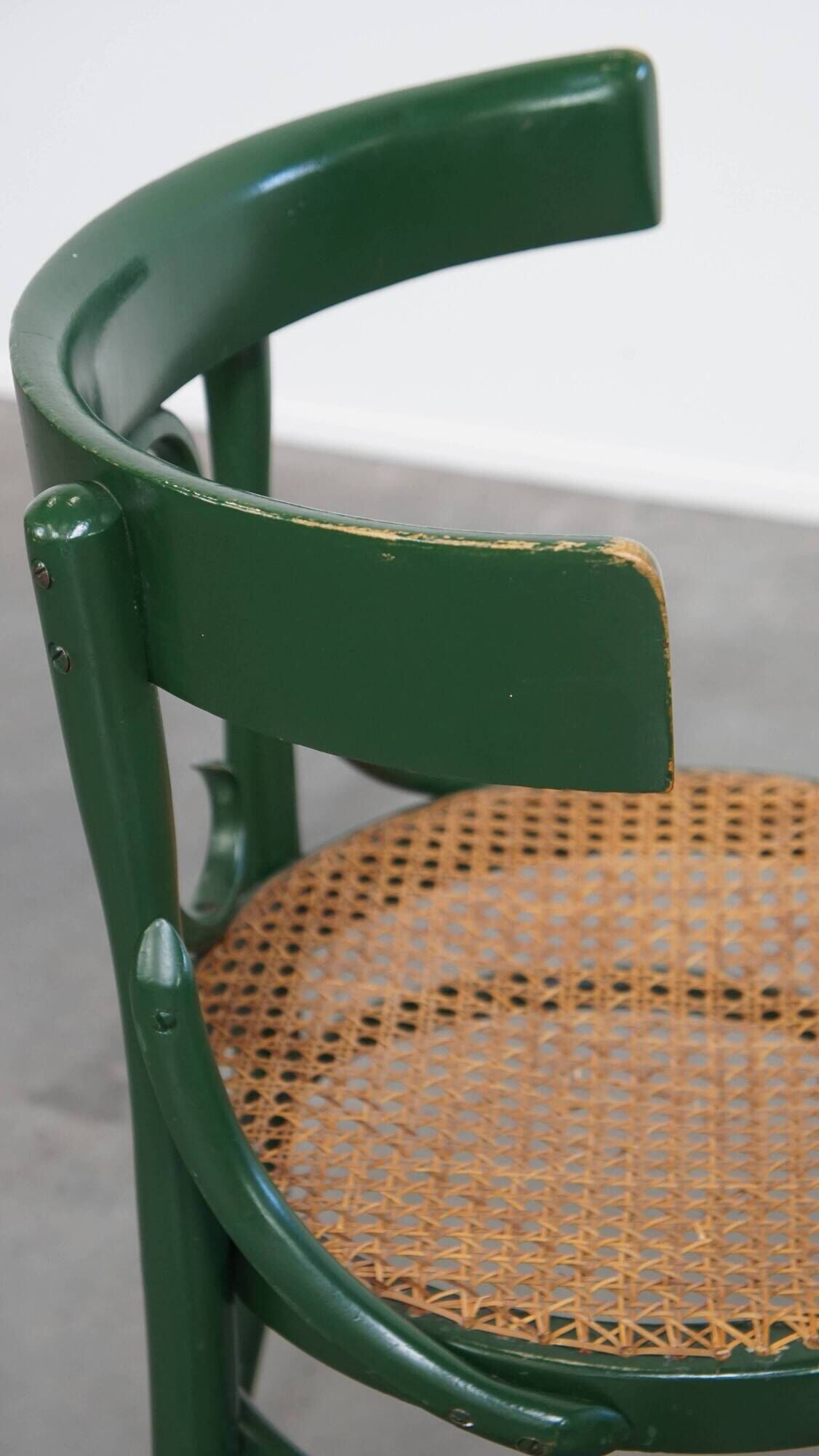 Vintage green bistro chair with woven reed seat