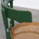 Vintage green bistro chair with woven reed seat