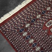 Handwoven red Boukhara oriental rug, 1960s