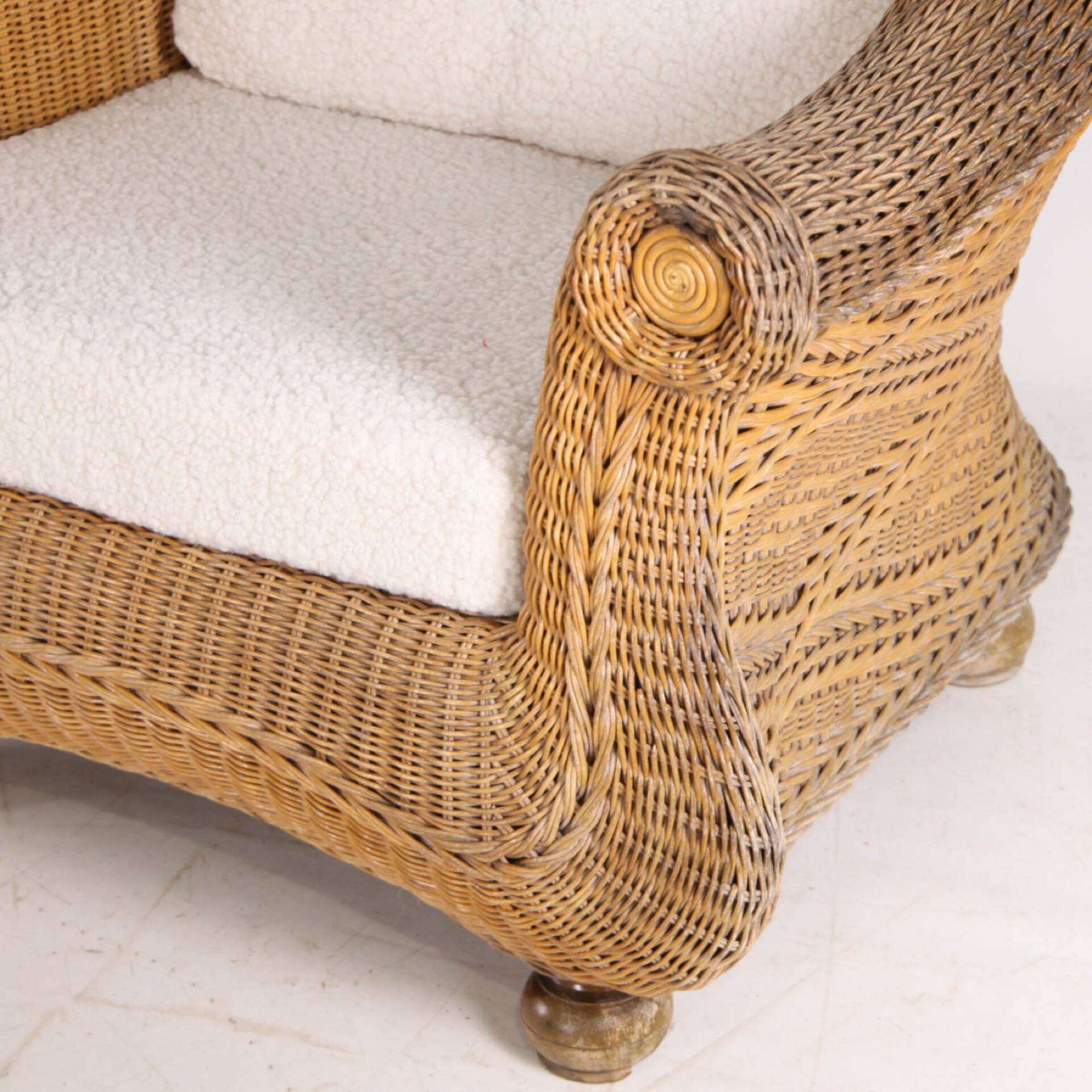 Pair of woven wicker armchairs
