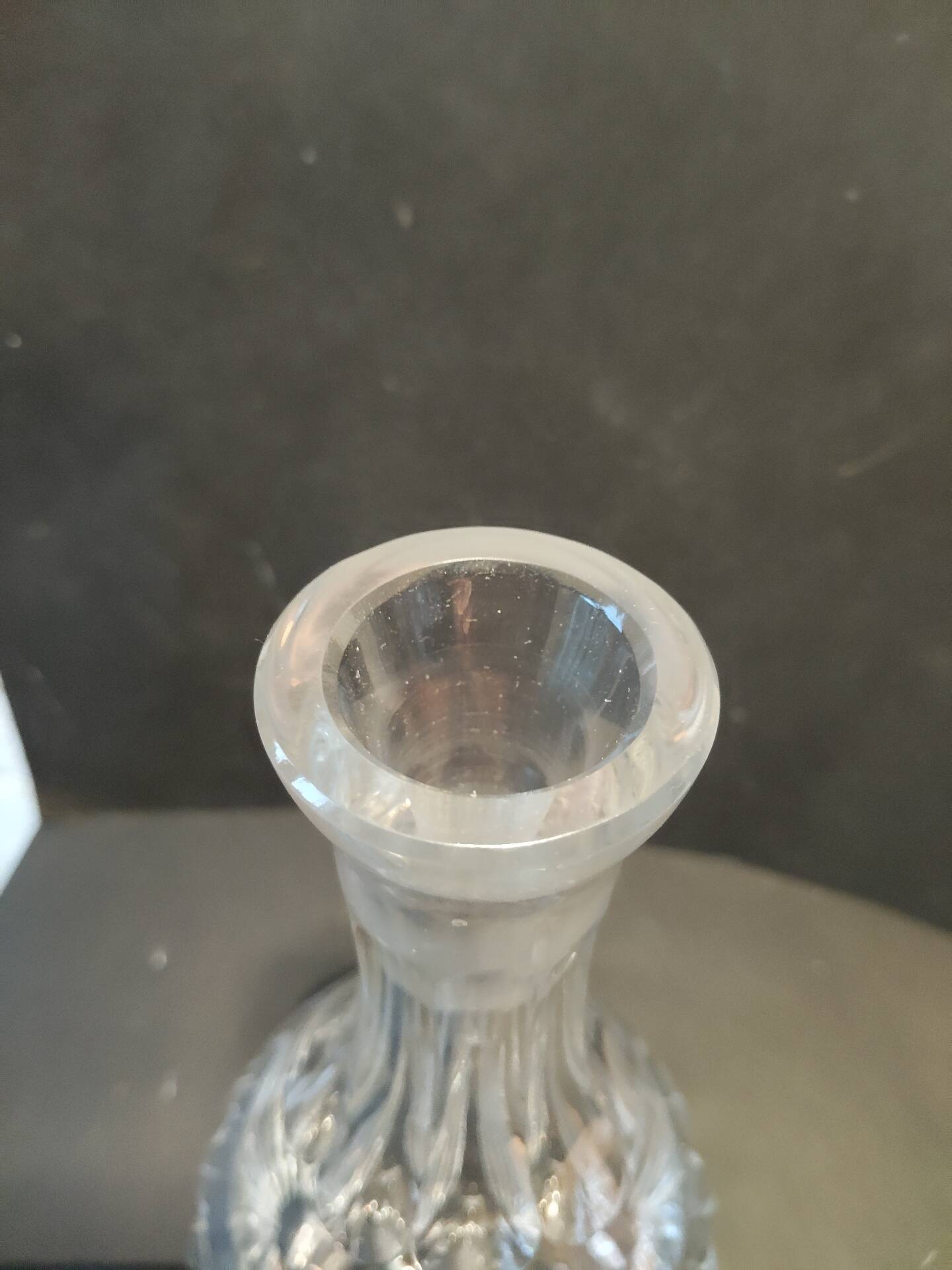Vintage cut crystal carafe with floral stopper.