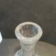 Vintage cut crystal carafe with floral stopper.