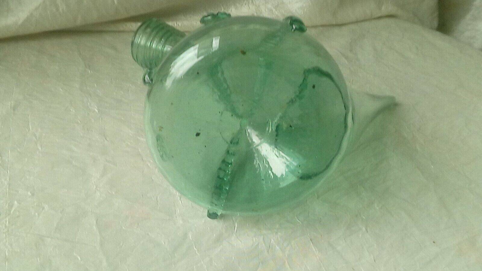 Blown glass carafe with a goat design.