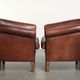 Set of 2 sheepskin club armchairs in a dark cognac colour