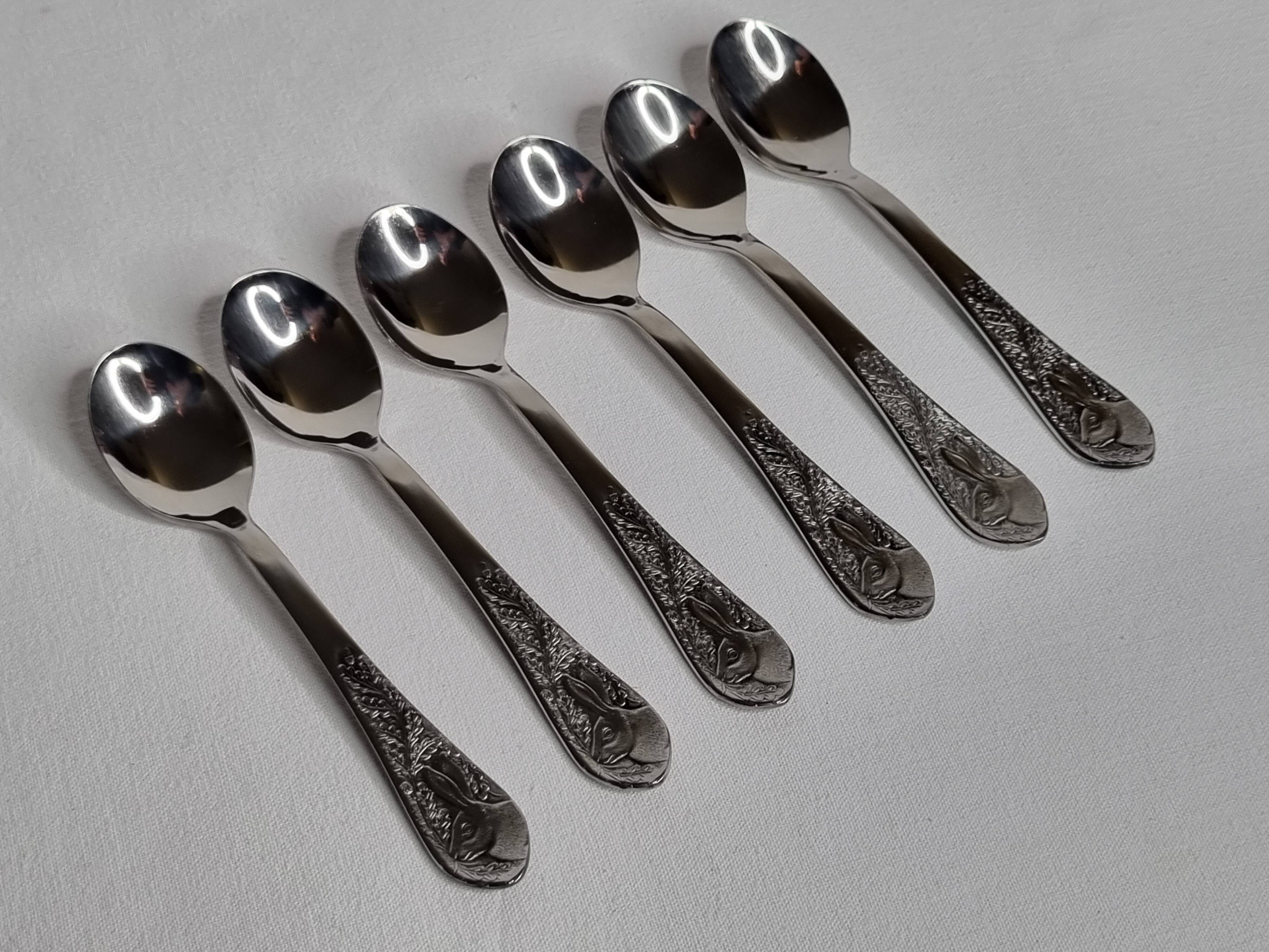 Set of six "Burgsil" stainless steel teaspoons with rabbit decoration