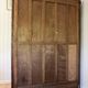 Old solid wood wardrobe with three vintage mirror doors