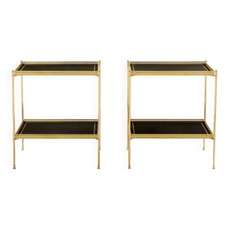 Pair of neoclassical side tables in brass and black leather by Maison Jansen, 1960.