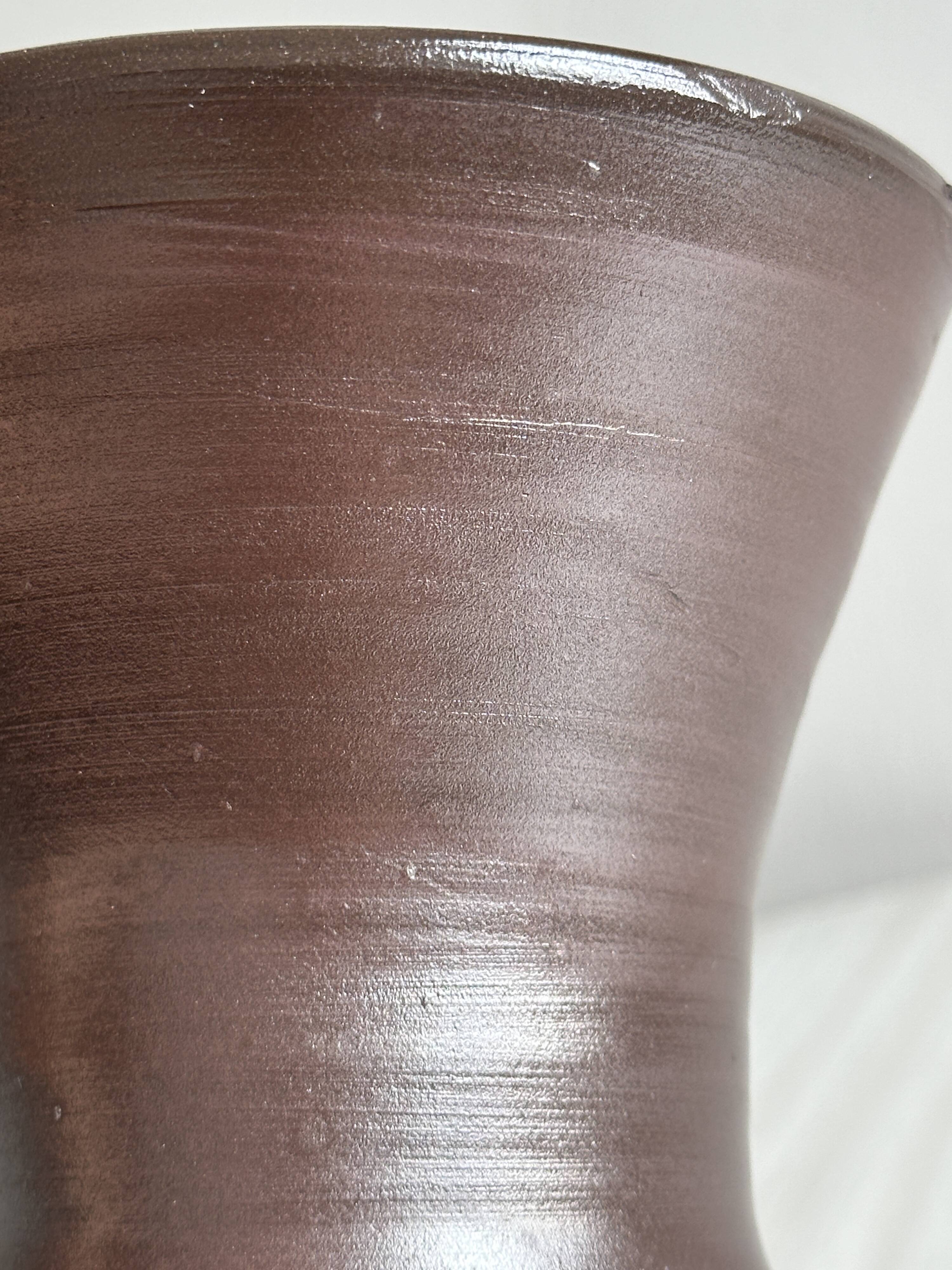 Dark brown ceramic vase, flared shape, smooth finish, classic style
