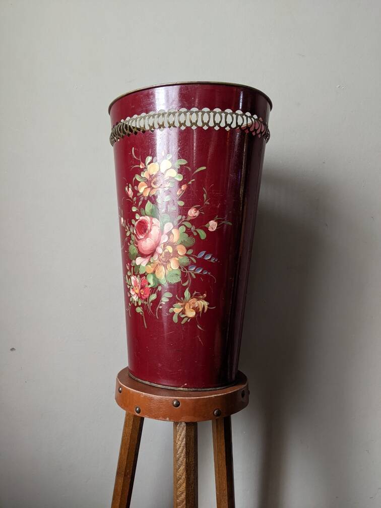 Antique metal umbrella stand with hand-painted floral decor, bohemian countryside