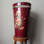 Antique metal umbrella stand with hand-painted floral decor, bohemian countryside