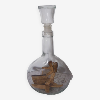 Bottle with brandy inclusion wood