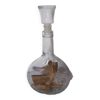 Bottle with brandy inclusion wood