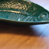 Ceramic serving flat plate in the shape of green fish