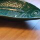 Ceramic serving flat plate in the shape of green fish