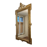 Antique Louis XVI style mirror in gilded wood
