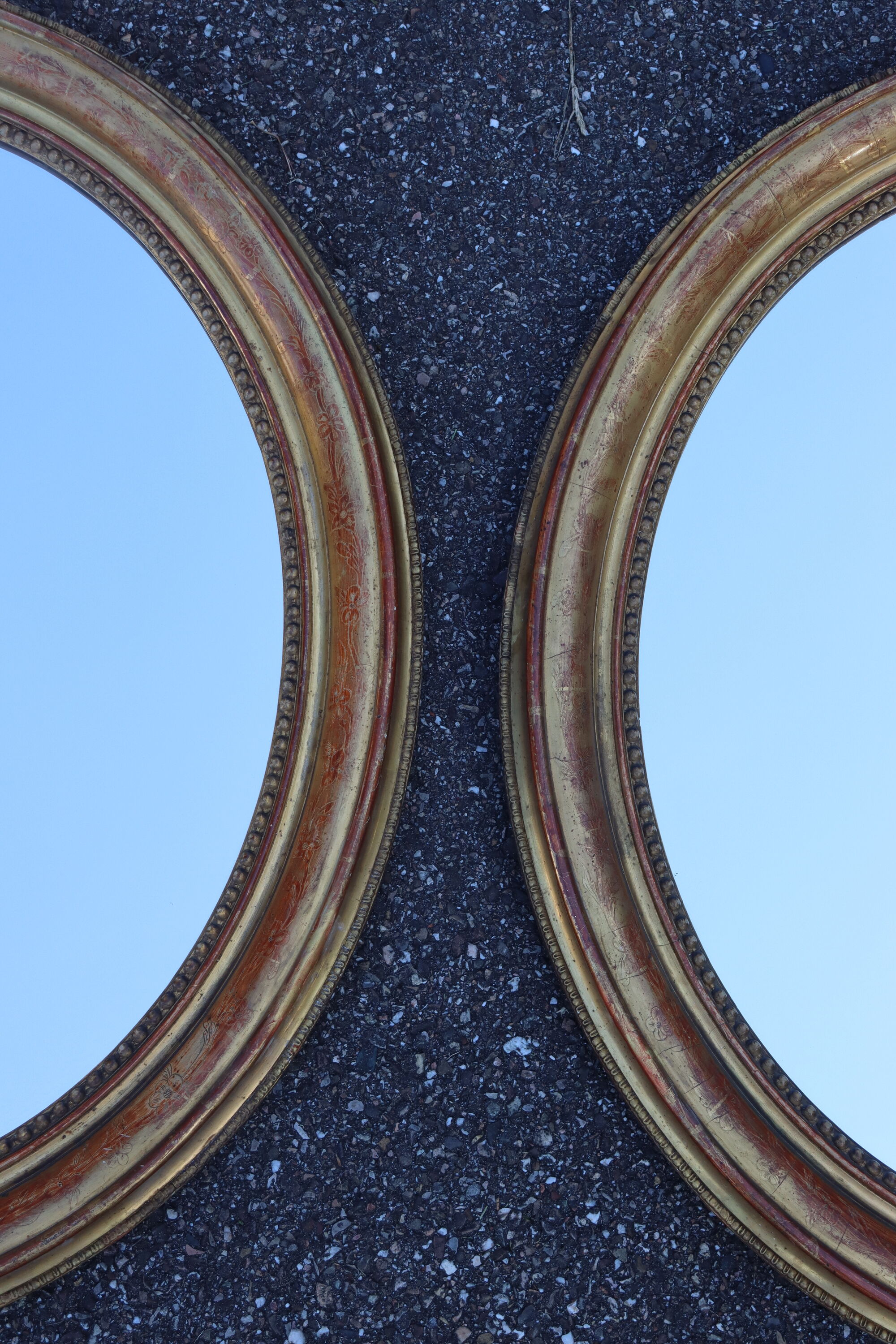 Pair of oval mirrors from the Louis Philippe period in gilded wood.